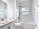 Modern bathroom with a shower and tub, sleek fixtures, and a vanity, creating a refreshing and functional space at 3514 Yacht Club Ct, Kissimmee, FL 34746