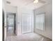 Bright bedroom with neutral walls, tile flooring, and a closet, offering a serene and functional space at 3514 Yacht Club Ct, Kissimmee, FL 34746