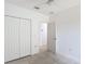 Inviting bedroom featuring neutral colors, a closet, and smooth flooring, providing a clean and versatile living space at 3514 Yacht Club Ct, Kissimmee, FL 34746