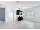 Airy living room featuring ceramic tile flooring, a large television, and a cozy ambiance at 3514 Yacht Club Ct, Kissimmee, FL 34746