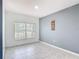 Bright living room with ceramic tile flooring, a serene color scheme, and natural light streaming through large windows at 3514 Yacht Club Ct, Kissimmee, FL 34746
