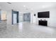 Open-concept living area with modern finishes, ceramic tile flooring, and stylish design elements at 3514 Yacht Club Ct, Kissimmee, FL 34746
