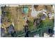 Aerial view of property showcasing lush landscaping and neighborhood streets at 6519 Shadowbrook Run, Lakeland, FL 33813