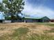 View of the home exterior with a shed in the backyard at 6519 Shadowbrook Run, Lakeland, FL 33813
