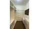 Walk-in closet with shelving, drawers, and hanging racks at 6519 Shadowbrook Run, Lakeland, FL 33813