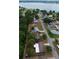 Aerial view showcasing the property's proximity to the lake and lush green surroundings at 5801 Poinciana Ave, Lakeland, FL 33809
