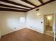Bedroom with new wood floor, bright window, and cozy charm, creating a peaceful and inviting space at 5801 Poinciana Ave, Lakeland, FL 33809