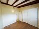 Bedroom with new wood floor, a large closet, and cozy charm, creating a peaceful and inviting space at 5801 Poinciana Ave, Lakeland, FL 33809