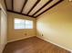 Bedroom with new wood floor, bright window, and cozy charm, creating a peaceful and inviting space at 5801 Poinciana Ave, Lakeland, FL 33809