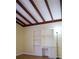 Bedroom with new wood floor, a built-in desk with bookshelves, and cozy charm, creating an inspiring space at 5801 Poinciana Ave, Lakeland, FL 33809