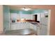 Bright kitchen featuring white cabinets, durable countertops and modern appliances at 5801 Poinciana Ave, Lakeland, FL 33809