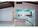 Open kitchen featuring tiled flooring, white cabinets, and modern appliances at 5801 Poinciana Ave, Lakeland, FL 33809