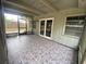 Enclosed patio with tile floors and screen windows at 5801 Poinciana Ave, Lakeland, FL 33809