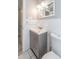 Cozy bathroom featuring a tiled wall, modern sink and vanity, and bright lighting at 760 Formosa Ave, Bartow, FL 33830