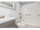 Bright bathroom featuring a tub-shower combo, modern vanity, and neutral fixtures, with a clean and timeless design at 760 Formosa Ave, Bartow, FL 33830