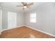 Bedroom with hardwood flooring, ceiling fan, and a window providing plenty of natural light at 760 Formosa Ave, Bartow, FL 33830