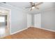 Bedroom featuring hardwood flooring, ceiling fan, and a closet at 760 Formosa Ave, Bartow, FL 33830