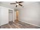 Bedroom showcasing wood-look flooring, ceiling fan, and closet for optimal storage at 760 Formosa Ave, Bartow, FL 33830