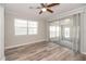 Bright bedroom with wood-look floors, ceiling fan and slider to Florida room at 760 Formosa Ave, Bartow, FL 33830