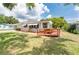 Charming single-story home featuring a front yard and wooden deck, perfect for relaxing outdoors at 760 Formosa Ave, Bartow, FL 33830