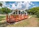 Inviting home exterior showcasing a lovely wooden deck, ideal for enjoying the outdoors and entertaining at 760 Formosa Ave, Bartow, FL 33830