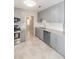 Modern kitchen with stainless steel appliances and grey cabinets and granite countertops at 760 Formosa Ave, Bartow, FL 33830
