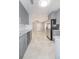 Modern kitchen with stainless steel appliances, gray cabinets, granite countertops, and tile floors at 760 Formosa Ave, Bartow, FL 33830
