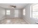 Cozy living room featuring neutral walls, a ceiling fan, and a pair of windows at 760 Formosa Ave, Bartow, FL 33830