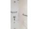 Close-up of a pristine shower with white tile, and grab bars at 760 Formosa Ave, Bartow, FL 33830