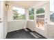 Bright sunroom with lots of windows, tile floor, and a glass door to let the natural light in at 760 Formosa Ave, Bartow, FL 33830