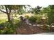 Beautiful backyard garden featuring a stone path, mature trees, and comfortable seating area perfect for relaxing at 925 Fenton Ln # 11, Lakeland, FL 33809