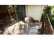 Cozy balcony featuring comfortable wicker furniture and a stylish rug, perfect for relaxing outdoors at 925 Fenton Ln # 11, Lakeland, FL 33809
