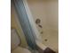 Bathroom featuring a bathtub with a shower head and a blue and white patterned shower curtain at 925 Fenton Ln # 11, Lakeland, FL 33809