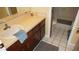 Well-lit bathroom with a single sink vanity and a door leading to the bathtub and toilet at 925 Fenton Ln # 11, Lakeland, FL 33809