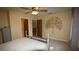 Spacious bedroom with unique wall art, light fixture, and doorway into another room at 925 Fenton Ln # 11, Lakeland, FL 33809