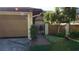 Charming home exterior with garage, walkway and lush landscaping at 925 Fenton Ln # 11, Lakeland, FL 33809