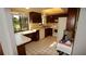 Cozy kitchen with wooden cabinets, tile flooring and bright natural lighting at 925 Fenton Ln # 11, Lakeland, FL 33809
