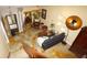 High angle view of a living room with unique flooring, decorative mirror, and modern furniture at 925 Fenton Ln # 11, Lakeland, FL 33809
