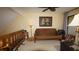 Comfortable living room with a futon, table lamp, and a picture on the wall above the futon at 925 Fenton Ln # 11, Lakeland, FL 33809