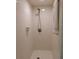Clean and modern shower stall with white tile, complemented by a sleek, minimalist design at 925 Fenton Ln # 11, Lakeland, FL 33809