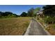 Scenic walking path beside a grassy area, perfect for an evening stroll in the community at 925 Fenton Ln # 11, Lakeland, FL 33809