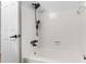 Bathroom tub and shower area has tiled walls and updated fixtures at 1586 Fergason Ave, Deltona, FL 32725