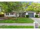 Charming single-story home with a lush front yard and attached one car garage at 1586 Fergason Ave, Deltona, FL 32725
