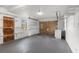 Spacious garage with shelving, door to house, and a roll-up door at 1586 Fergason Ave, Deltona, FL 32725