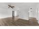 Spacious living room with ceiling fan and wood-look flooring at 1586 Fergason Ave, Deltona, FL 32725