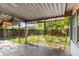 Covered patio and view of the backyard and fence at 1586 Fergason Ave, Deltona, FL 32725