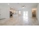 Spacious and airy living room with tile flooring, recessed lighting, and sliding glass doors at 421 Arkansas Ct, Poinciana, FL 34759
