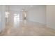 Bright, open living room with tile flooring and sliding glass doors for natural light at 421 Arkansas Ct, Poinciana, FL 34759
