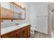 This bathroom has a vanity, a mirror, a toilet and shower at 18829 Starry St, Orlando, FL 32833