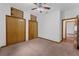 Bedroom features a ceiling fan and a closet with wood doors at 18829 Starry St, Orlando, FL 32833